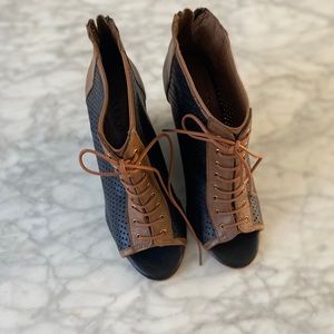 Women’s tan and black zip up wedges